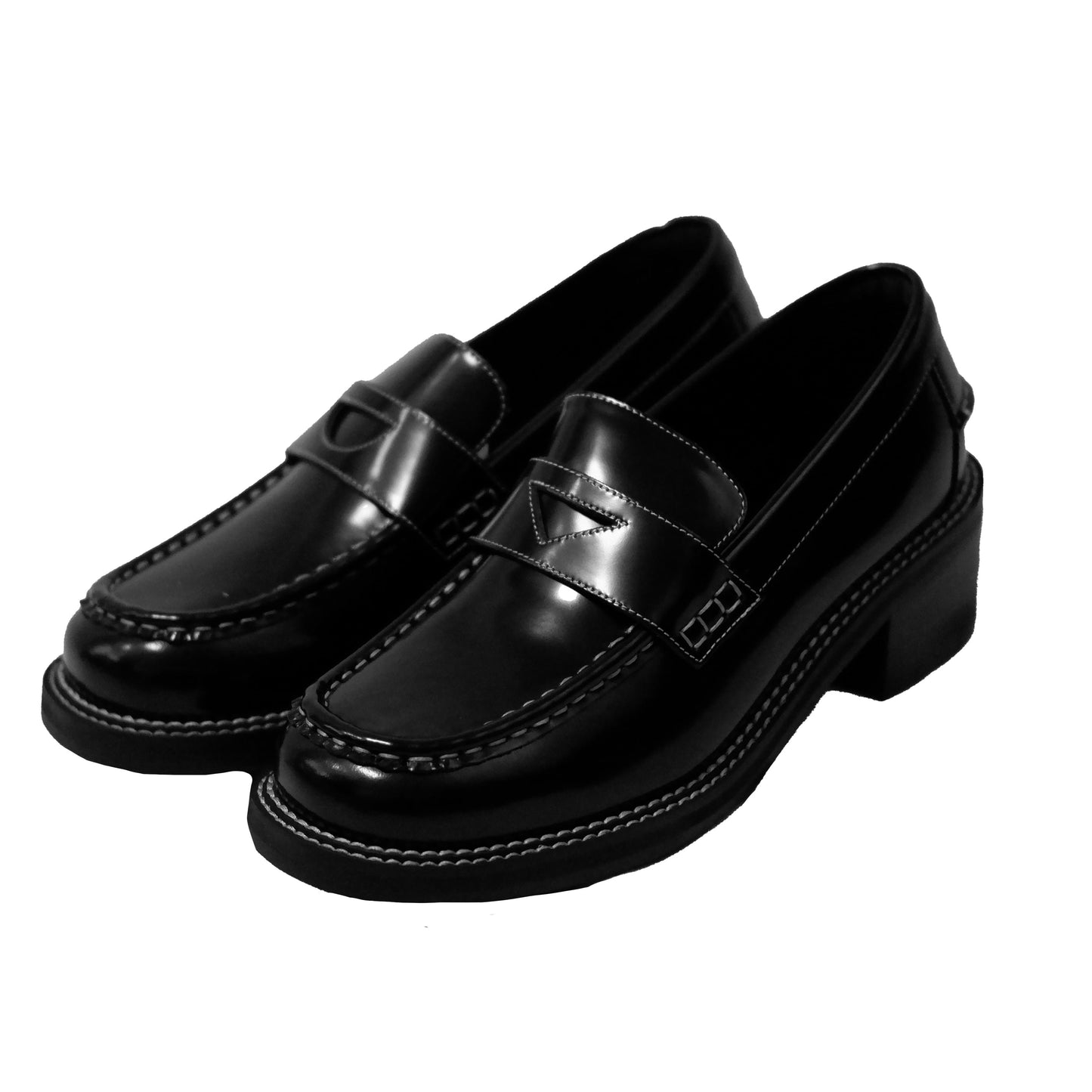 Side view of a pair of black leather loafer heels with asymmetric details for women.