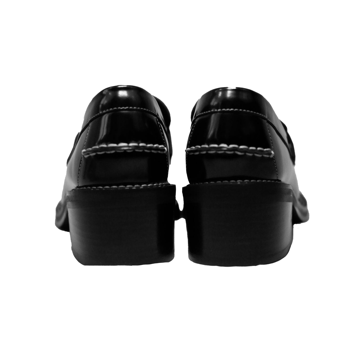 Back side view of a pair of black leather loafer heels with asymmetric details for women.
