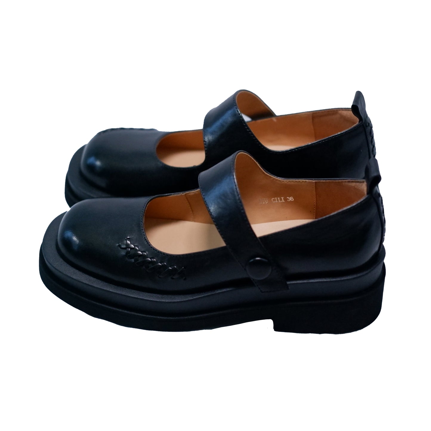 Side vide of black platform Mary Jane shoes with wide strap and low block heel