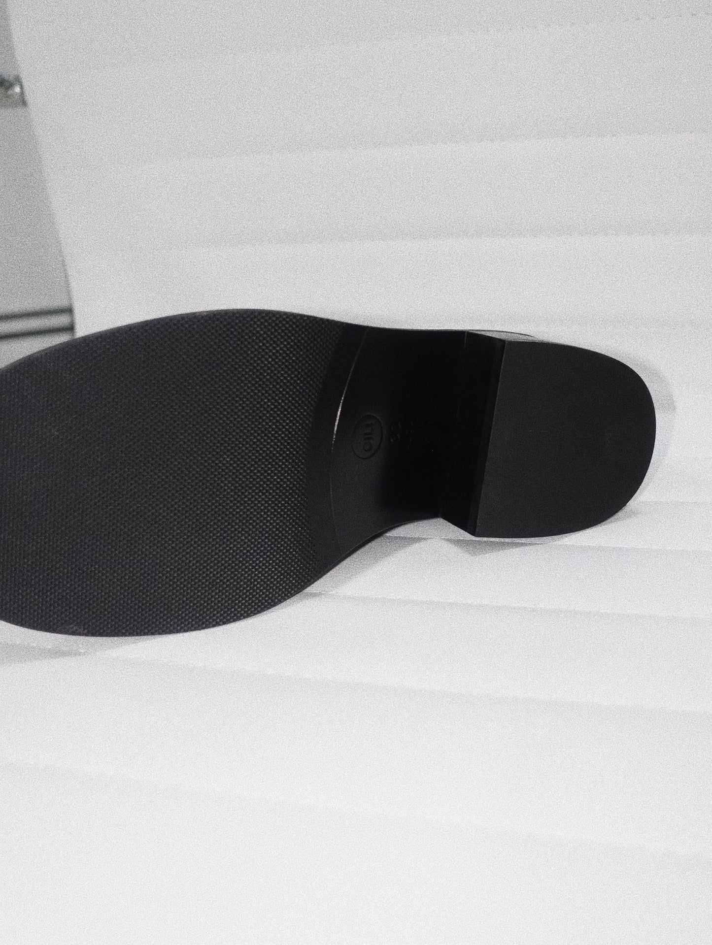 Bottom of the black leather loafer heel