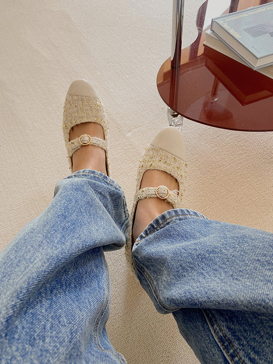 Stylish white Mary Janes featuring leather tweed design with asymmetric details for a modern touch.