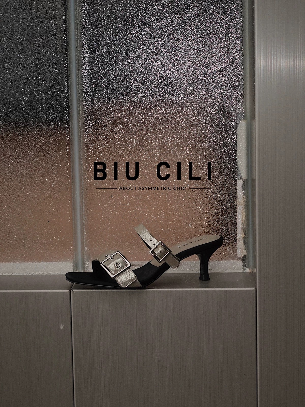 Minimalist summer mid heel sandals with asymmetrical silver buckle – side angle
