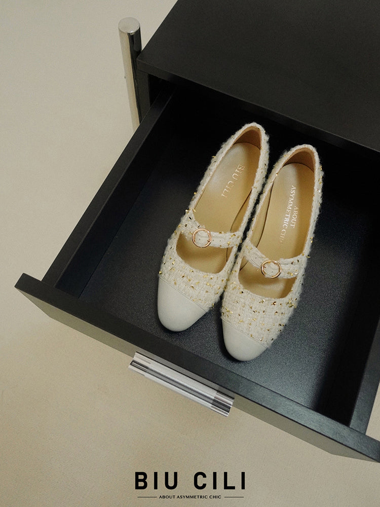 Stylish white Mary Janes featuring leather tweed design with asymmetric details for a modern touch.