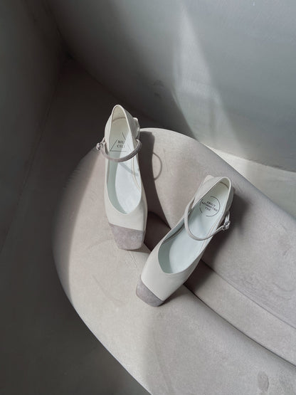 White leather square-toe Mary Jane heels with asymmetric ankle straps and light grey suede toe caps