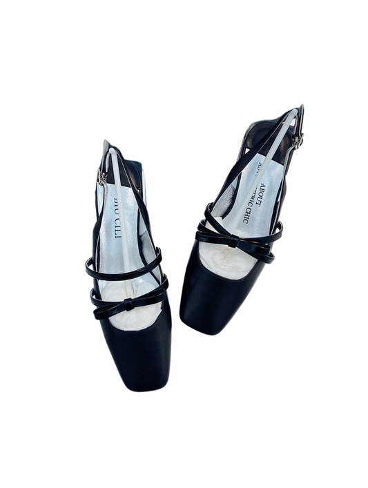 Black square toe Mary Jane shoes with asymmetric bow and low block heel