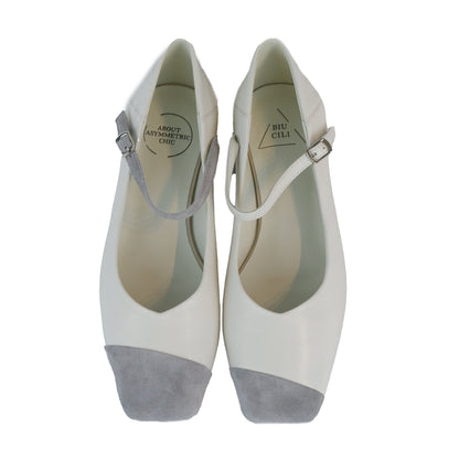 White leather square-toe Mary Jane heels with asymmetric ankle straps and light grey suede toe caps