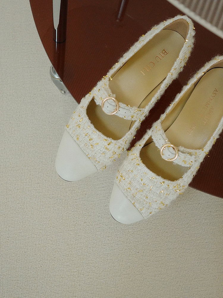 Stylish Mary Janes featuring leather tweed design with asymmetric details for a modern touch.