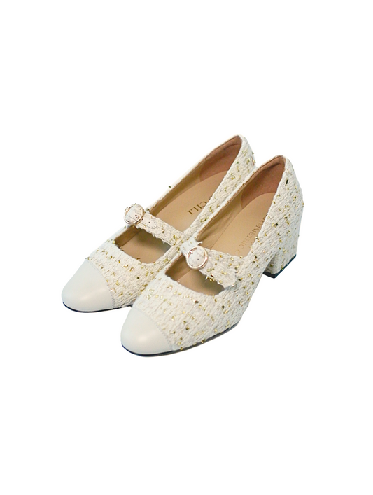 Stylish white Mary Janes featuring leather tweed design with asymmetric details for a modern touch.