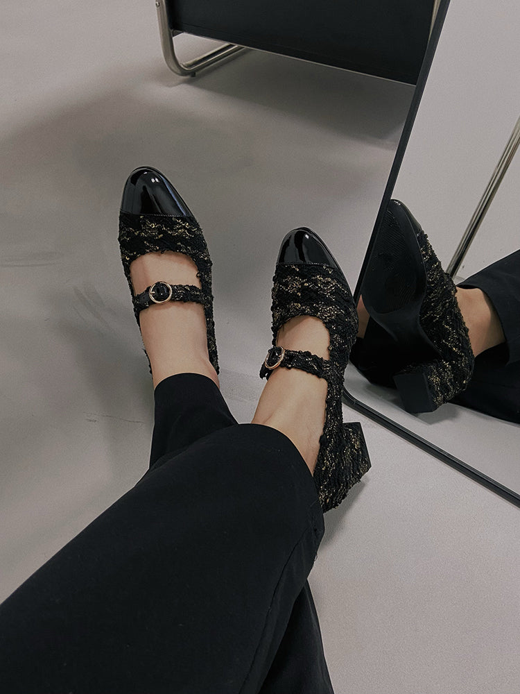 Stylish black Mary Janes featuring patent leather tweed design with asymmetric details for a modern touch.