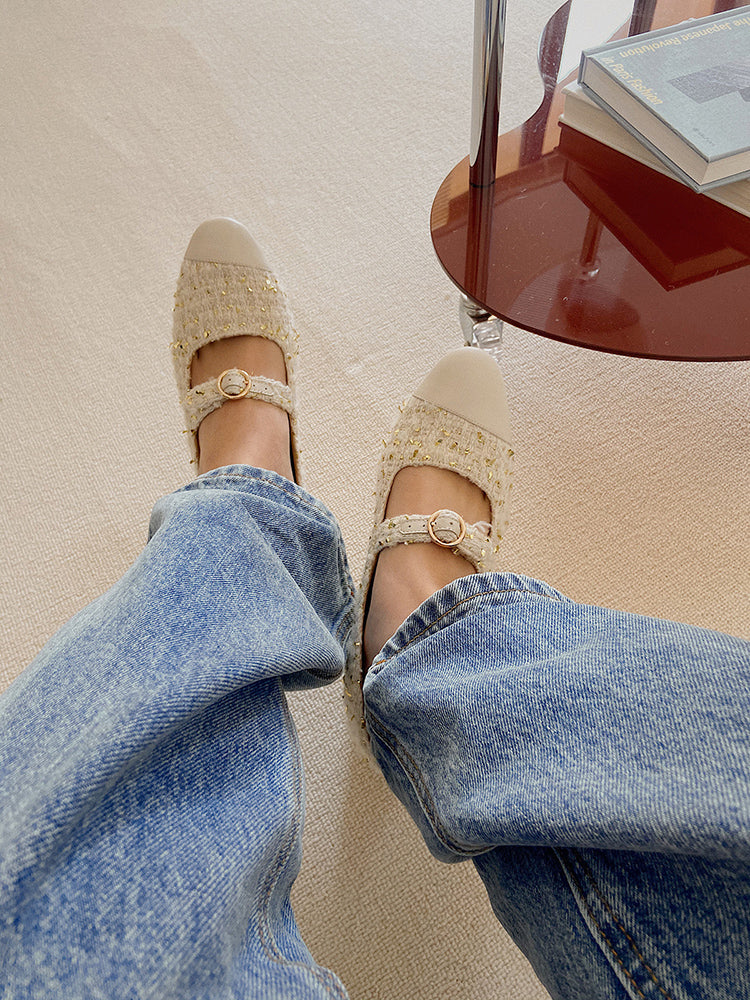 Stylish white Mary Janes featuring leather tweed design with asymmetric details for a modern touch.
