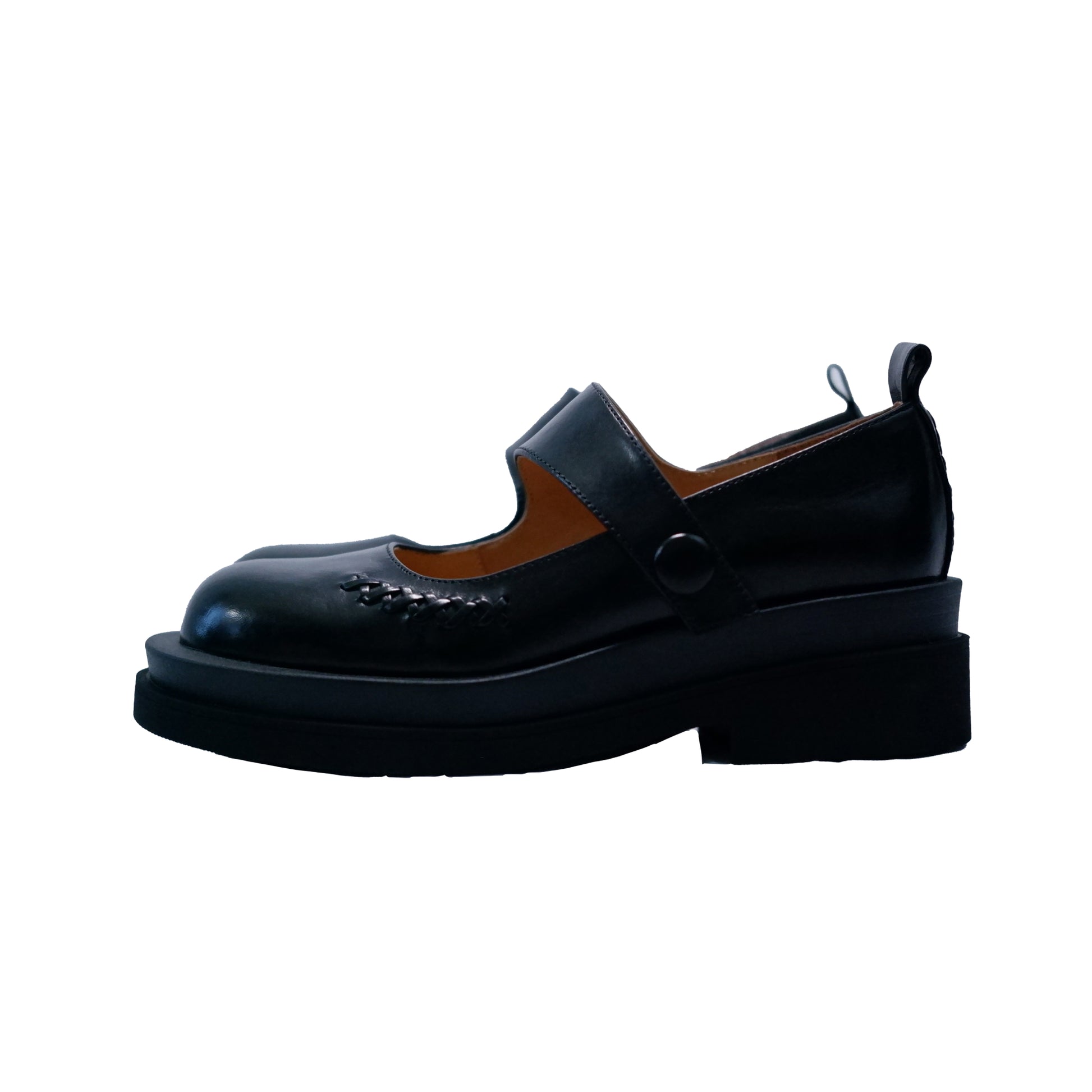 Side view of a black platform Mary Jane shoes with wide strap and low block heel