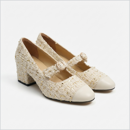 Stylish white Mary Janes featuring leather tweed design with asymmetric details for a modern touch.