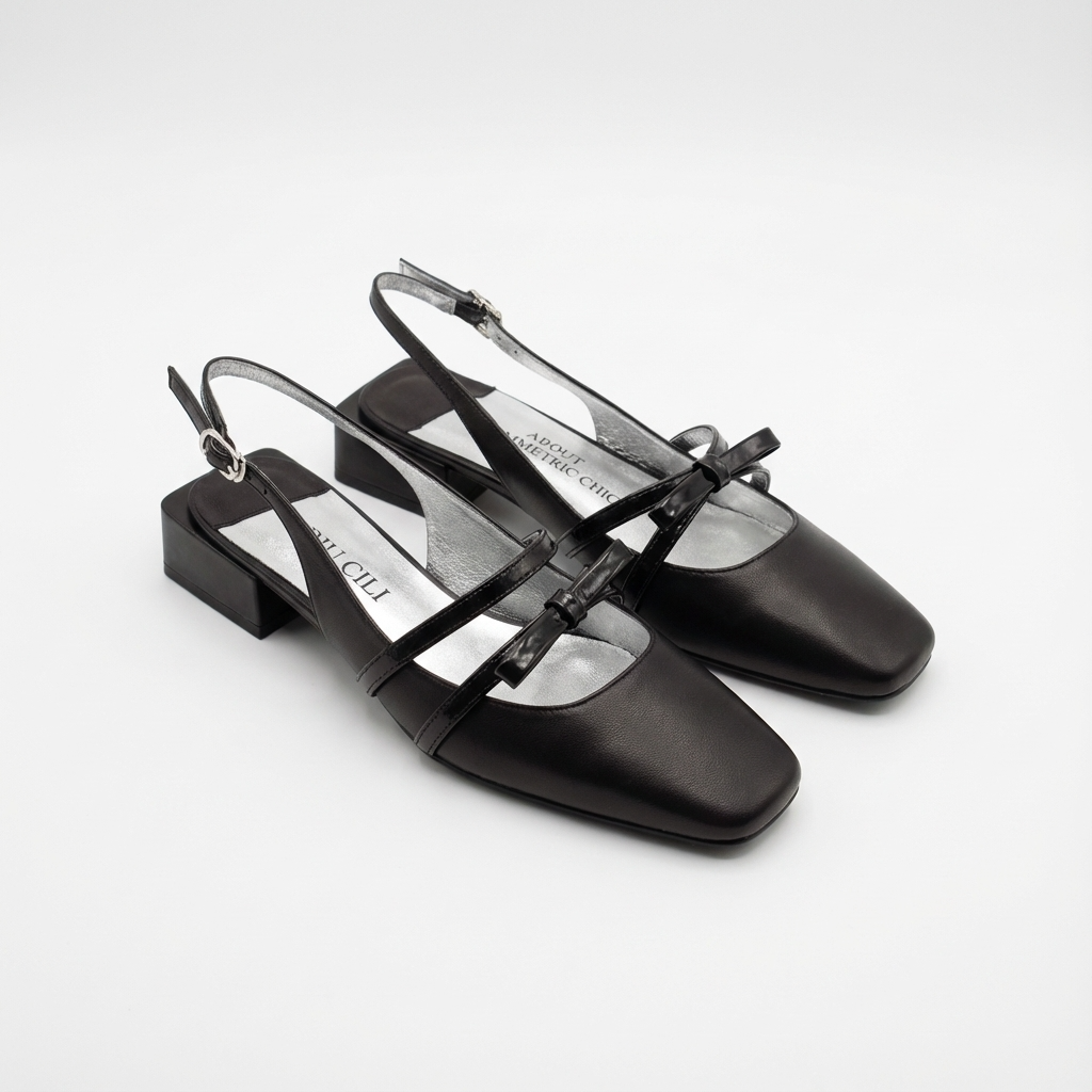 Black slingback shoes on a white background