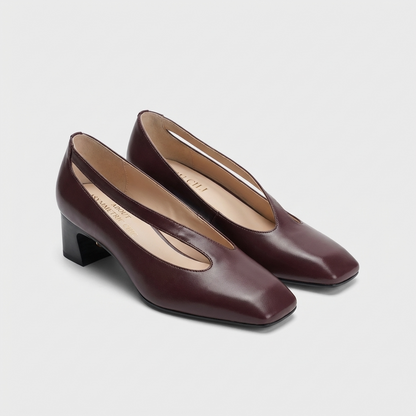 Pair of leather plum brown mid-heeled block shoes on a light gray background