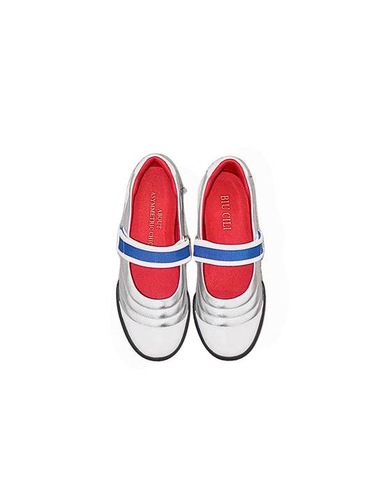 Upper view of Kaia asymmetric Mary Jane flats in silver, white leather, red lining, with a blue strap